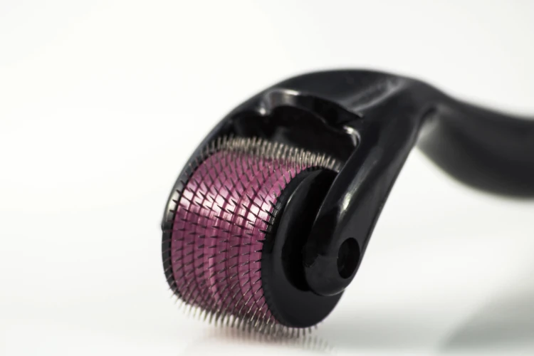 A close-up of an at-home microneedling apparatus.