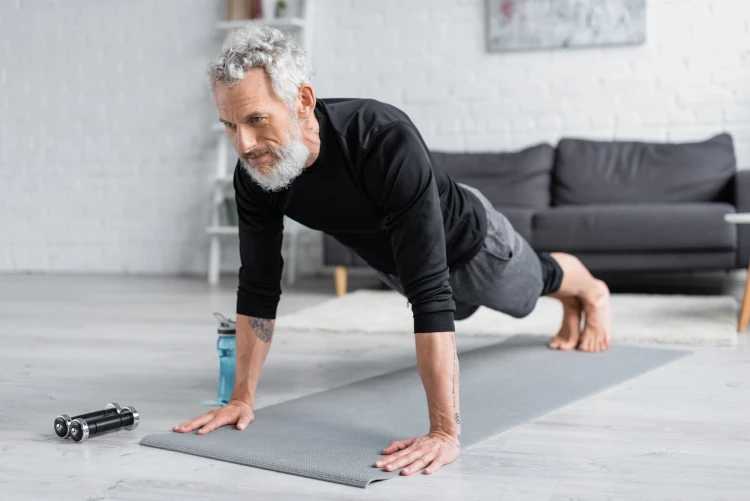 A person doing a plank on a yoga mat.